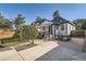 Charming home with a covered patio, hot tub, and landscaped front yard at 1749 S Lincoln St, Denver, CO 80210