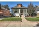 Charming bungalow featuring a well-manicured front yard and inviting front porch at 1749 S Lincoln St, Denver, CO 80210