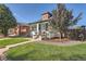 Charming home featuring a well-maintained front yard and a classic exterior design at 1749 S Lincoln St, Denver, CO 80210