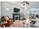 Cozy living room with fireplace, hardwood floors, and an open layout at 1749 S Lincoln St, Denver, CO 80210