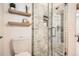 Bathroom featuring a marble tiled shower and modern fixtures at 1749 S Lincoln St, Denver, CO 80210