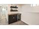 Stylish wet bar with sleek cabinetry and floating shelves, perfect for entertaining at 1749 S Lincoln St, Denver, CO 80210