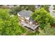 Aerial view displaying a beautiful home with a large deck and lush landscaping at 7330 Routt St, Arvada, CO 80005