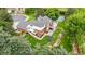 Expansive backyard featuring patio, deck, trampoline, and landscaped garden beds at 7330 Routt St, Arvada, CO 80005