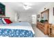 Bright bedroom featuring large window and ample storage in a wooden dresser at 7330 Routt St, Arvada, CO 80005