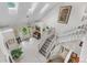 Bright foyer featuring skylights, tiled flooring, staircase, and well-lit entryway at 7330 Routt St, Arvada, CO 80005