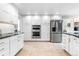 Spacious kitchen featuring stainless steel appliances, ample cabinetry, and sleek countertops at 7330 Routt St, Arvada, CO 80005