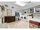 Large laundry room with appliances, storage cabinets and tile flooring at 7330 Routt St, Arvada, CO 80005