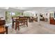 Spacious living room with access to an outdoor patio and dining area at 7330 Routt St, Arvada, CO 80005