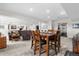 Open-concept living and dining area with a cozy seating area at 7330 Routt St, Arvada, CO 80005