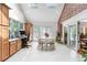 Bright dining/office area with skylights, desk, and view of the deck at 7330 Routt St, Arvada, CO 80005