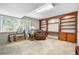 A comfortable office with built in wood shelving at 7330 Routt St, Arvada, CO 80005