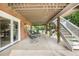 Shaded patio with comfortable seating and stairs leading to the backyard at 7330 Routt St, Arvada, CO 80005