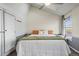 Bright and spacious bedroom features a vaulted ceiling, large windows, closet and neutral decor at 1907 S Helena St # G, Aurora, CO 80013