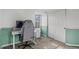 Bedroom featuring a modern desk, sliding closet doors, and neutral wall decor at 1907 S Helena St # G, Aurora, CO 80013