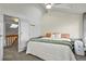 Spacious bedroom features large windows, closet, access to the staircase, and neutral decor at 1907 S Helena St # G, Aurora, CO 80013