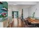Open dining area featuring hardwood floors and a peek into the living room at 1907 S Helena St # G, Aurora, CO 80013