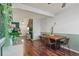 Inviting dining area featuring hardwood floors and a peek into the front entry at 1907 S Helena St # G, Aurora, CO 80013