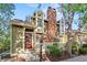 Attractive home exterior with a prominent brick chimney, stylish windows, and a well-maintained front yard at 1907 S Helena St # G, Aurora, CO 80013