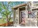 Inviting home entrance featuring a secure screen door, decorative flower basket, and a manicured front yard at 1907 S Helena St # G, Aurora, CO 80013
