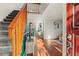 Spacious entryway flowing to the living room with hardwood floors and a staircase, creating an inviting atmosphere at 1907 S Helena St # G, Aurora, CO 80013