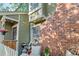 Back patio area featuring comfortable chairs, grilling area and fenced in yard at 1907 S Helena St # G, Aurora, CO 80013