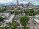 Multi-unit building with city skyline in background at 1735 N Ogden St # 303, Denver, CO 80218