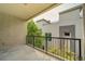 Private balcony overlooking trees and neighboring buildings at 1735 N Ogden St # 303, Denver, CO 80218