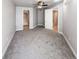 Spacious bedroom with plush carpeting and access to bathroom at 1735 N Ogden St # 303, Denver, CO 80218