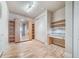 Bedroom with built-in shelves and a Murphy bed at 1735 N Ogden St # 303, Denver, CO 80218