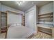 Guest bedroom with a Murphy bed and built-in shelving at 1735 N Ogden St # 303, Denver, CO 80218