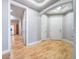 Open hallway with hardwood floors and access to rooms at 1735 N Ogden St # 303, Denver, CO 80218
