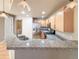 Modern kitchen with granite countertops and wood cabinets at 1735 N Ogden St # 303, Denver, CO 80218
