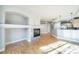 Open living area with hardwood floors and kitchen views at 1735 N Ogden St # 303, Denver, CO 80218