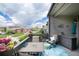 Cozy back deck is set up for entertaining with a dining table and beautiful views at 11823 Barrentine Loop, Parker, CO 80138