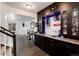 Entertainment space features a bar with wine storage, a mini fridge and a sink at 11823 Barrentine Loop, Parker, CO 80138