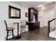 Entertaining area features a bar setup with modern barstools and stylish decor at 11823 Barrentine Loop, Parker, CO 80138