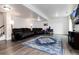 Finished basement with two sofas, a large area rug, and a mounted flat screen TV at 11823 Barrentine Loop, Parker, CO 80138