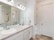 Bright bathroom features dual sinks, a large mirror, and a shower-tub combination at 11823 Barrentine Loop, Parker, CO 80138
