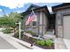 Close up of the home's entrance and landscaping, highlighting the American flag and stone accents at 11823 Barrentine Loop, Parker, CO 80138