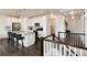Open kitchen with white cabinetry, stainless steel appliances, and a center island with bar seating at 11823 Barrentine Loop, Parker, CO 80138