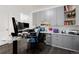 A well-organized home office features built in cabinets, desk area, and ample storage at 11823 Barrentine Loop, Parker, CO 80138