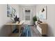 Bright home office offers a functional work space, natural light, and stylish decor at 11823 Barrentine Loop, Parker, CO 80138