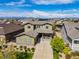 Aerial view of a lovely home, nestled in a neighborhood with beautiful mountain views at 525 Grenville Cir, Erie, CO 80516