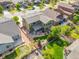 Aerial view of a house with mature trees, fenced yard, and proximity to neighborhood amenities at 525 Grenville Cir, Erie, CO 80516