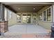 Covered patio with concrete flooring, sliding glass doors, and a view of the backyard at 525 Grenville Cir, Erie, CO 80516