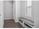Mud room with built-in bench, storage baskets, and coat rack at 525 Grenville Cir, Erie, CO 80516