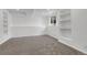 Finished basement with built in shelving and window at 8935 Sleepy Grass Ct, Parker, CO 80134