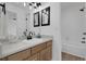 Bright bathroom featuring a vanity and tub at 8935 Sleepy Grass Ct, Parker, CO 80134