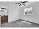 Bedroom with ceiling fan and bathroom access at 8935 Sleepy Grass Ct, Parker, CO 80134